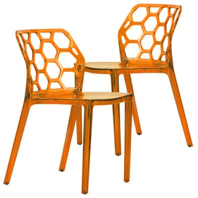 2 LeisureMod Dynamic Transparent Orange Dining Chairs